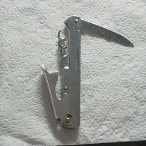 Multi wine and bottle opener..stainless steel..never used..hypoallergenic..